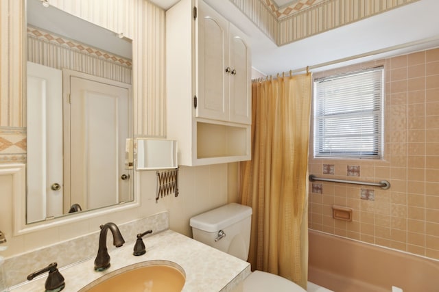 bathroom featuring vanity, shower / bath combination with curtain, toilet, and wallpapered walls