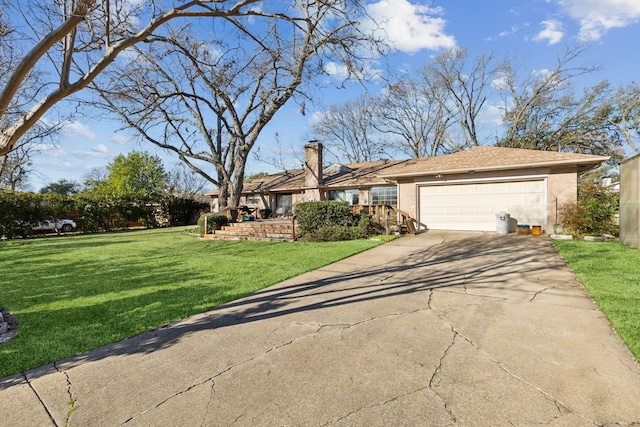 view of front of property with brick siding, a garage, driveway, and a front yard