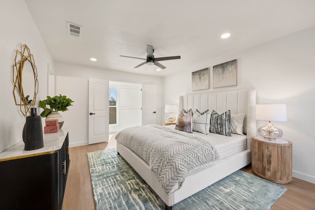 bedroom featuring visible vents, light wood-style flooring, recessed lighting, baseboards, and ceiling fan