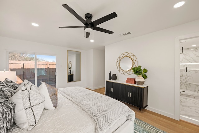 bedroom with visible vents, baseboards, light wood-type flooring, recessed lighting, and ensuite bath