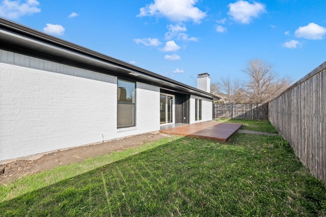 view of yard with a fenced backyard