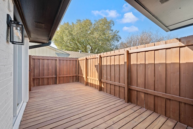 wooden terrace featuring fence