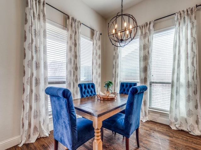 dining room with a notable chandelier and wood finished floors