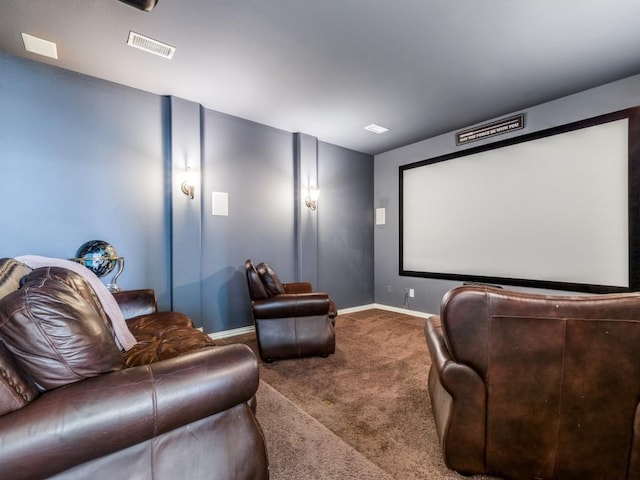 carpeted cinema room with baseboards and visible vents