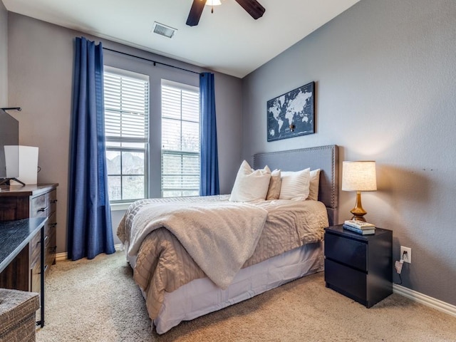 bedroom with visible vents, ceiling fan, carpet, and baseboards