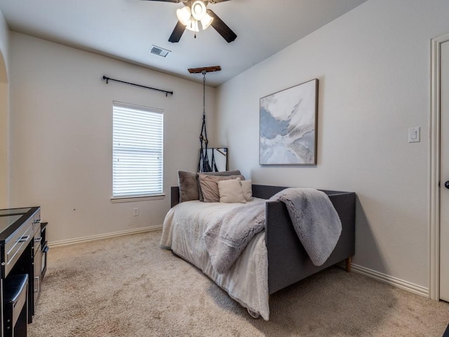 bedroom with a ceiling fan, carpet flooring, baseboards, and visible vents