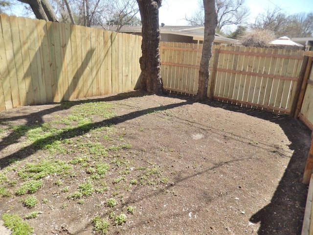 view of yard featuring a fenced backyard