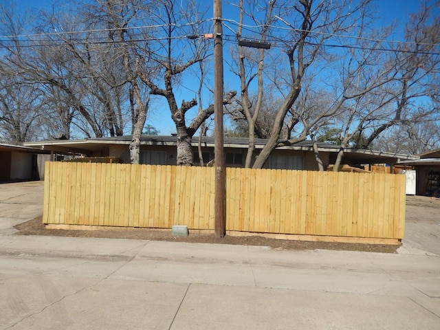 view of property exterior featuring fence