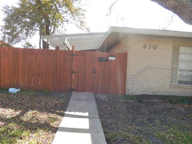 exterior space featuring fence and a gate