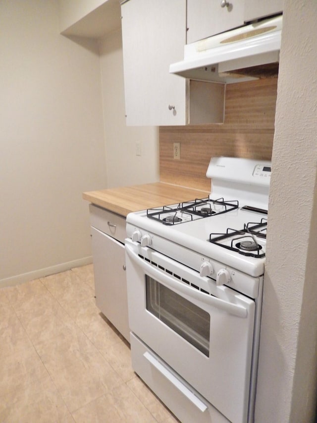 kitchen with baseboards, under cabinet range hood, light countertops, white range with gas stovetop, and white cabinets