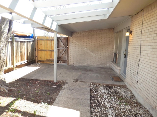 view of patio / terrace featuring a gate and fence