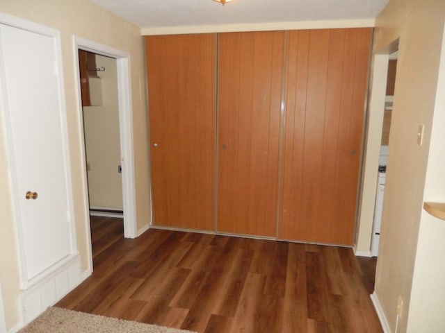 unfurnished bedroom featuring wood finished floors