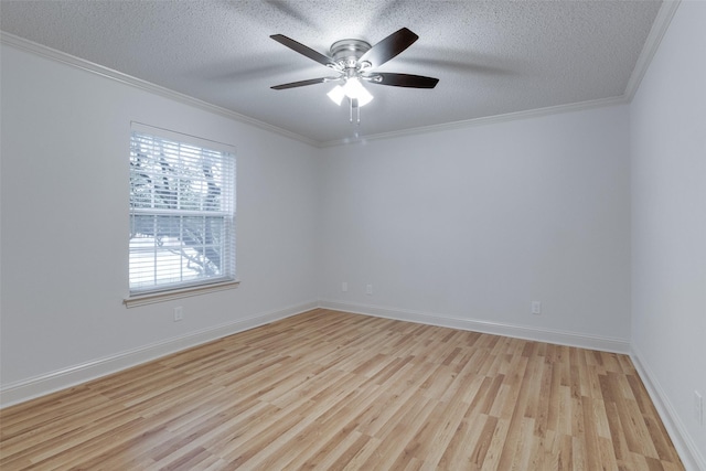 unfurnished room featuring a textured ceiling, crown molding, baseboards, and wood finished floors