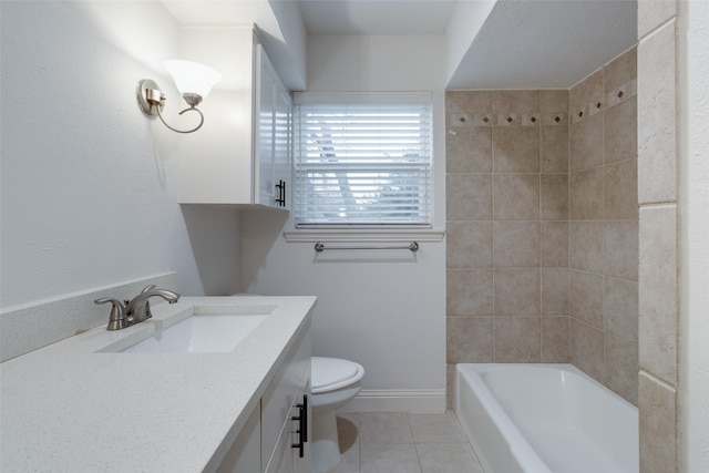 bathroom with vanity, tile patterned floors, toilet, and baseboards