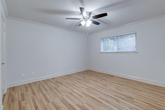 empty room featuring a textured ceiling, crown molding, and light wood finished floors