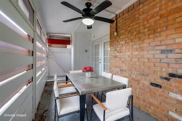 unfurnished sunroom with french doors and a ceiling fan