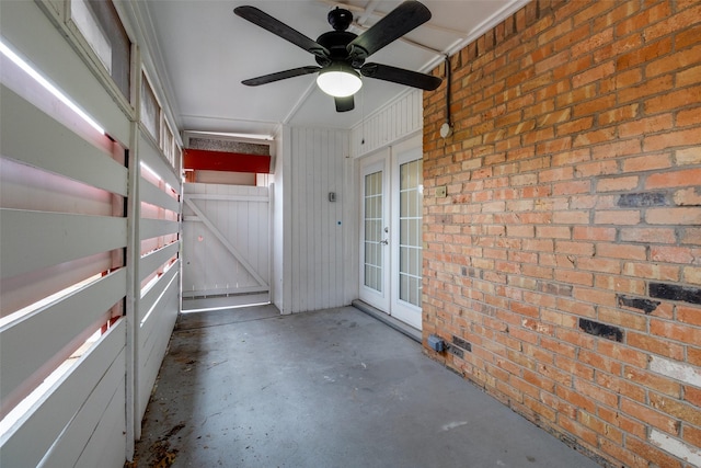 interior space with french doors and ceiling fan