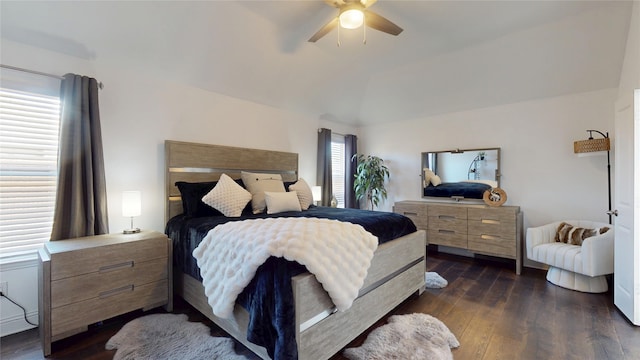 bedroom with lofted ceiling, dark wood finished floors, and a ceiling fan