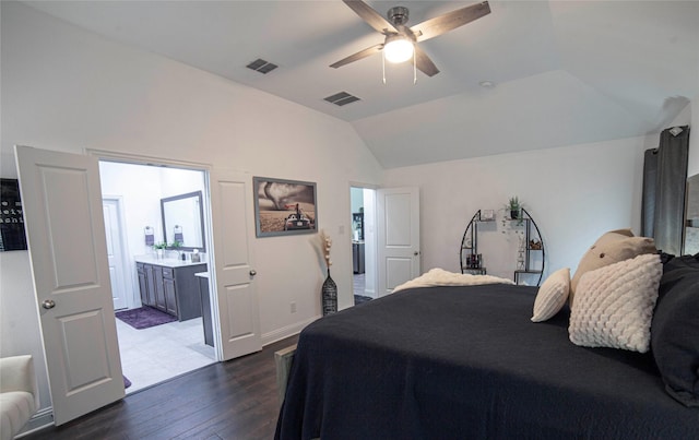 1525 Wagon Wheel Way, Krum, TX 76249 - bedroom with dark wood-type flooring, lofted ceiling, ceiling fan, and ensuite bath