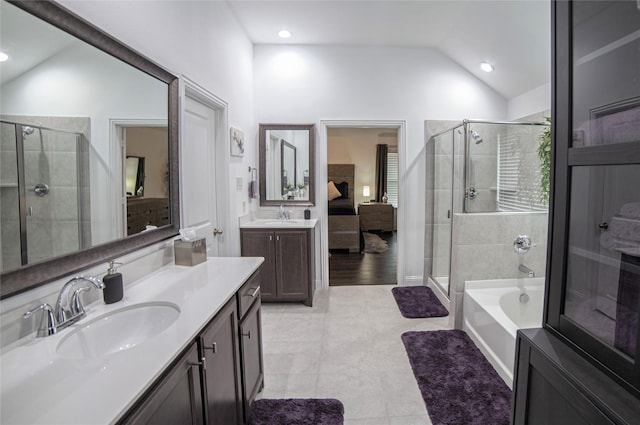 1525 Wagon Wheel Way, Krum, TX 76249 - full bathroom with lofted ceiling, a stall shower, two vanities, a garden tub, and tile patterned flooring