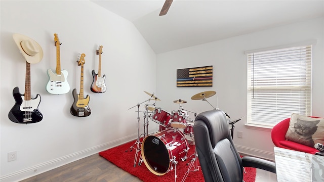 office space with lofted ceiling, wood finished floors, and baseboards