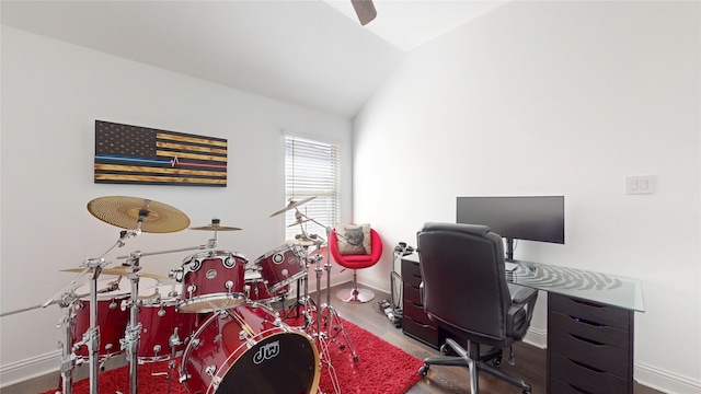 office featuring ceiling fan, baseboards, and lofted ceiling