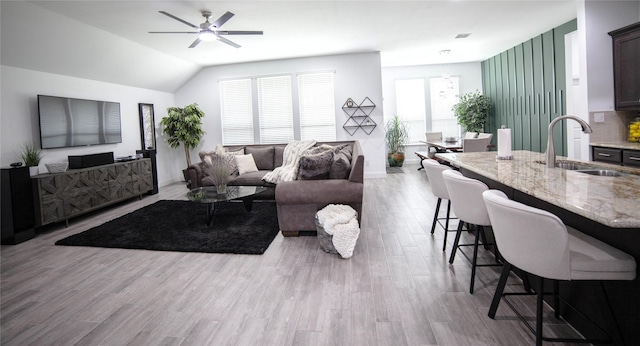 1525 Wagon Wheel Way, Krum, TX 76249 - living room with wood finished floors, a ceiling fan, lofted ceiling, and baseboards