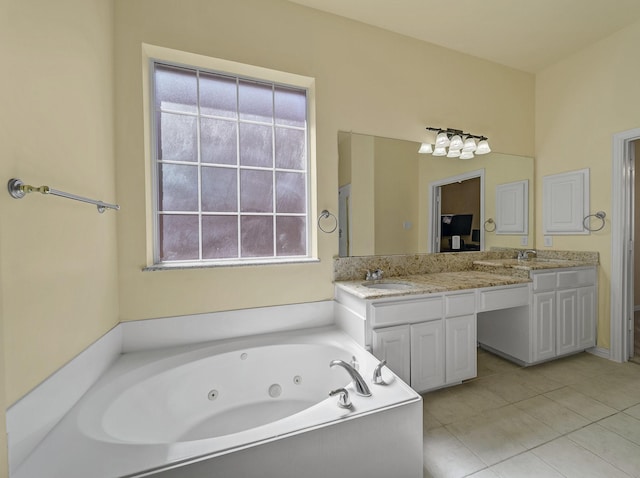 full bath with tile patterned floors, a tub with jets, a sink, and double vanity