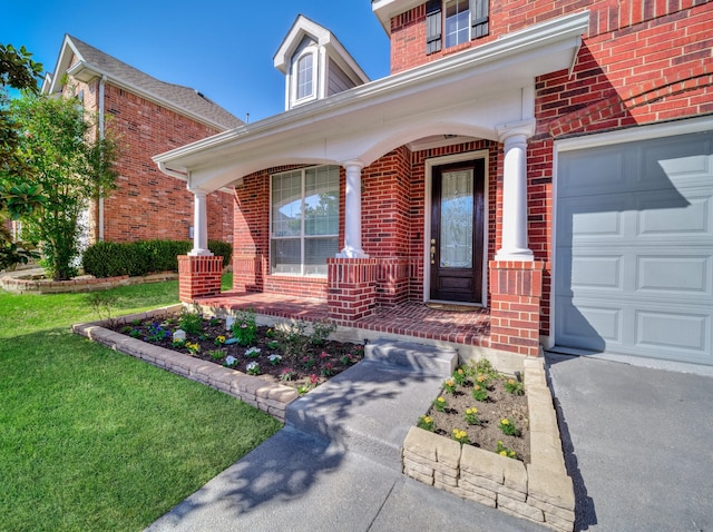 entrance to property featuring brick siding, a porch, an attached garage, and a lawn