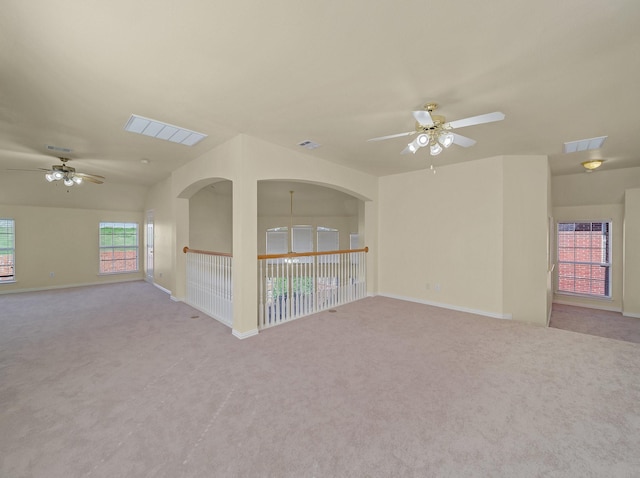 spare room with visible vents, baseboards, and carpet