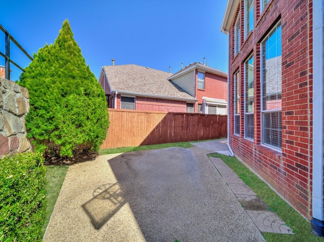 view of yard with a patio and fence