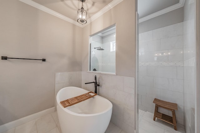 bathroom featuring a walk in shower, baseboards, ornamental molding, a soaking tub, and tile walls