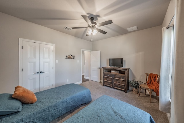 bedroom featuring a closet, visible vents, ceiling fan, and carpet floors