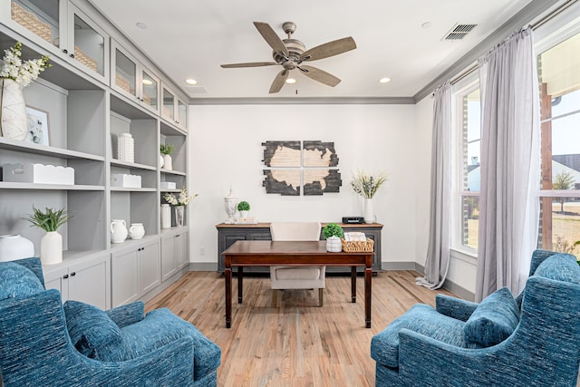 office space featuring visible vents, light wood-style flooring, and baseboards