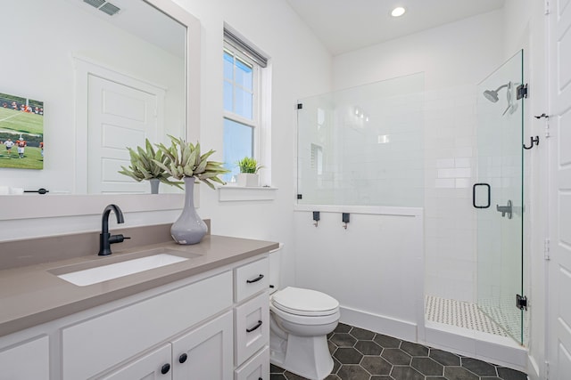 full bathroom with visible vents, toilet, recessed lighting, a shower stall, and vanity