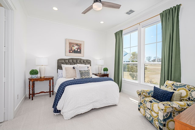 carpeted bedroom with recessed lighting, visible vents, baseboards, and crown molding