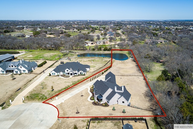 drone / aerial view featuring a water view and a residential view