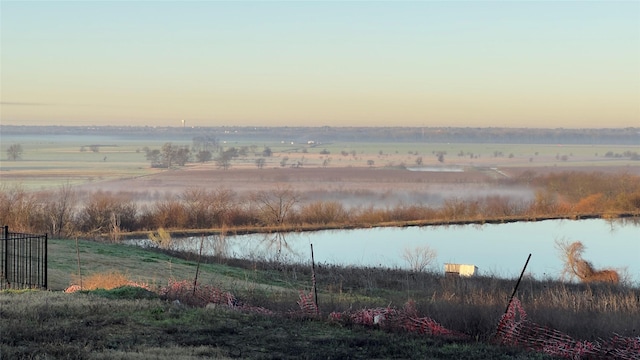 water view featuring a rural view and fence