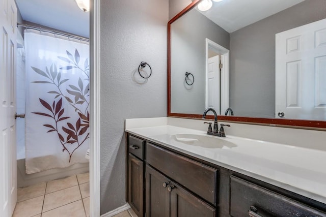 full bath with tile patterned floors, toilet, shower / tub combo with curtain, and vanity