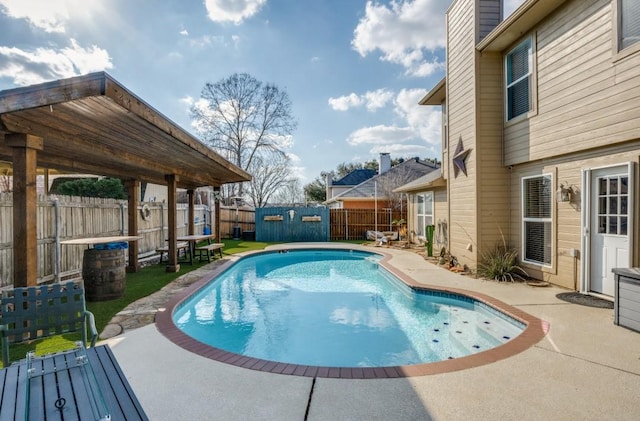 view of pool featuring a patio, a fenced backyard, and a fenced in pool