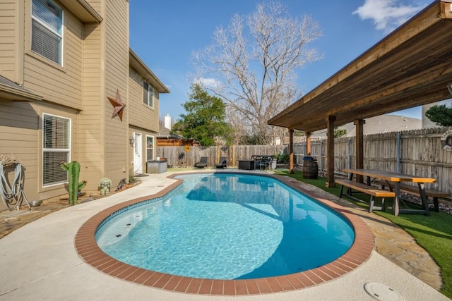 view of pool with a patio area, a fenced in pool, and a fenced backyard