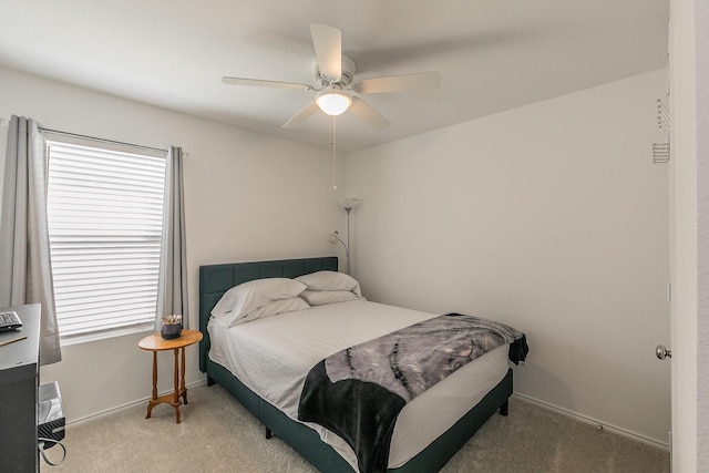 bedroom with baseboards, carpet, and ceiling fan