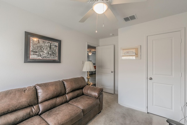 living room featuring light carpet, visible vents, baseboards, and ceiling fan