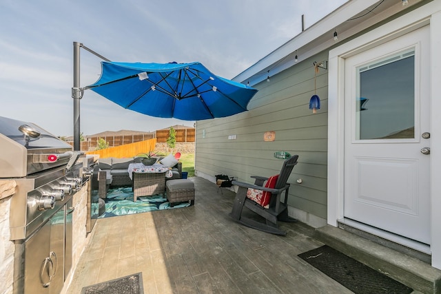 view of patio / terrace with an outdoor living space and fence