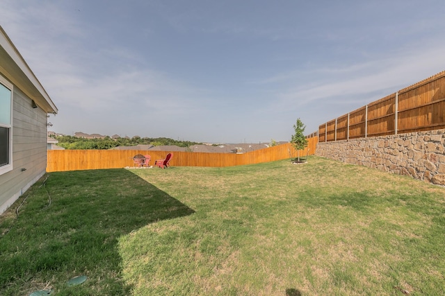 view of yard with a fenced backyard