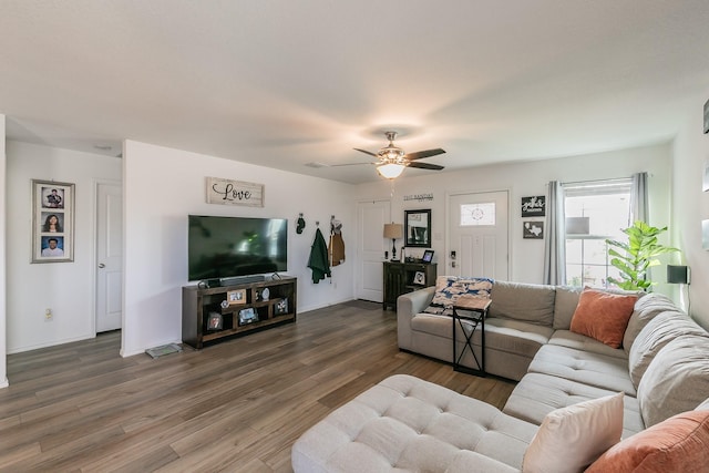 living area featuring wood finished floors and ceiling fan