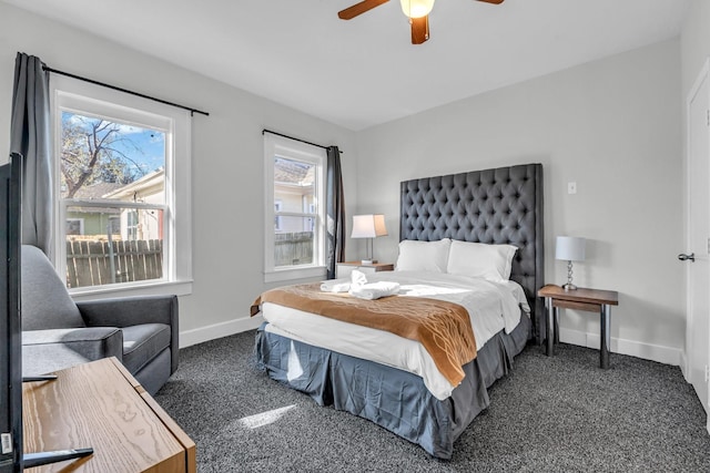 carpeted bedroom with a ceiling fan and baseboards