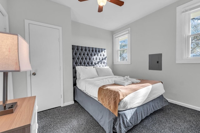 bedroom featuring electric panel, baseboards, carpet, and a ceiling fan