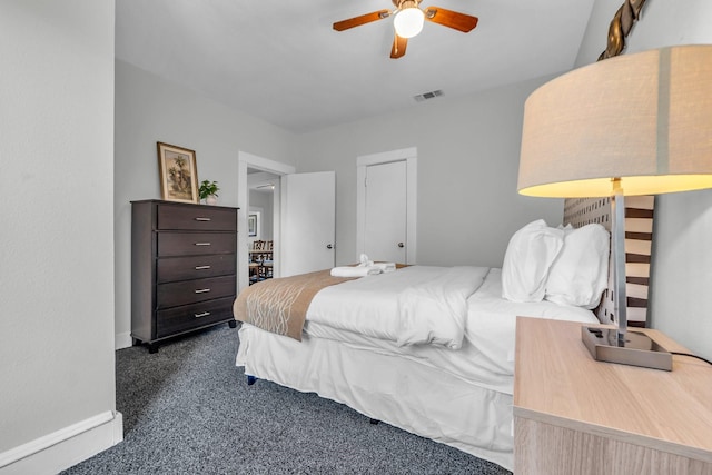 bedroom featuring visible vents, ceiling fan, baseboards, and dark colored carpet