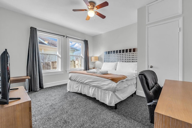 bedroom with a ceiling fan, baseboards, and carpet floors